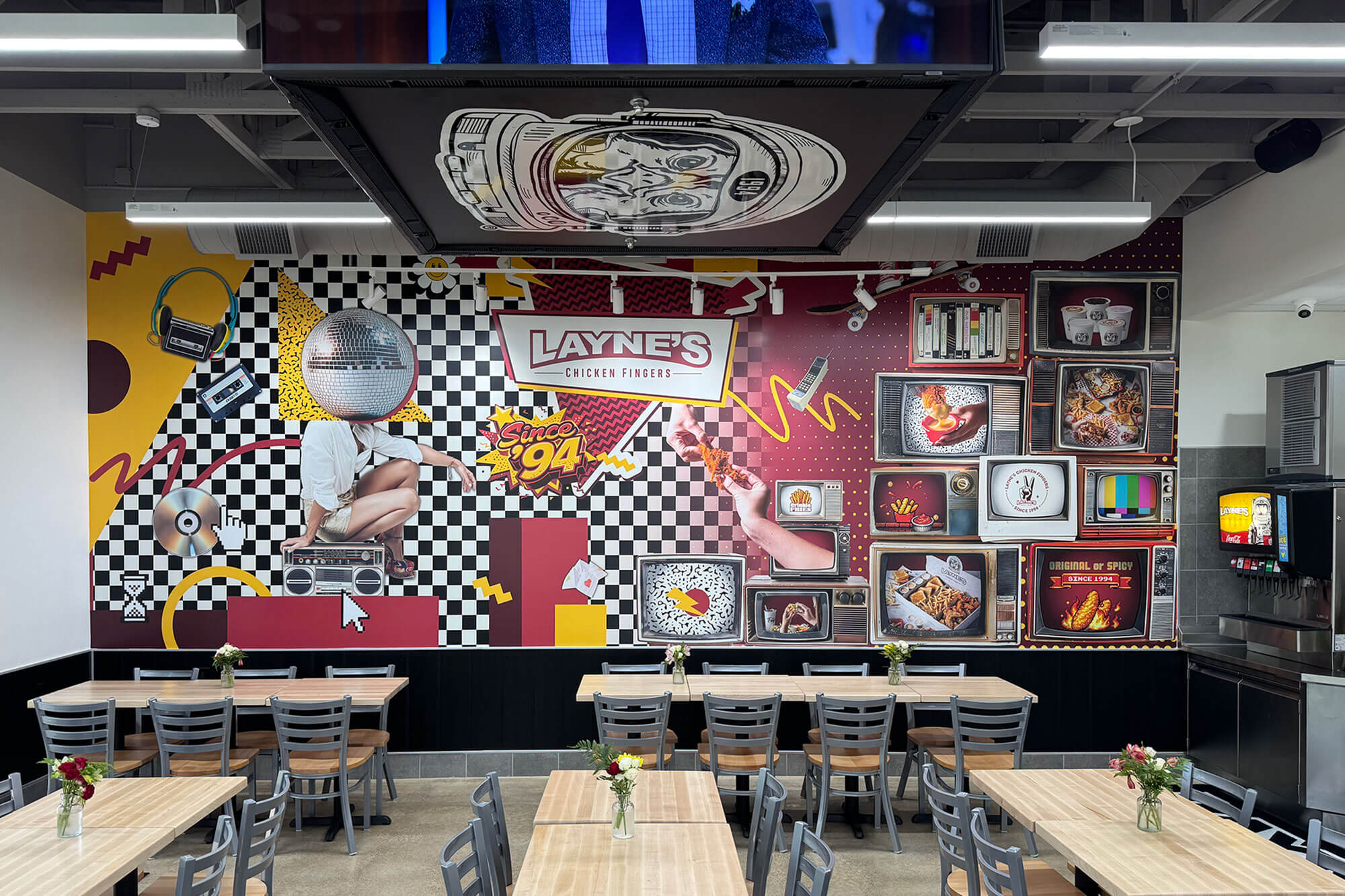 Interior of a Layne's location with a 1994 mural on the wall